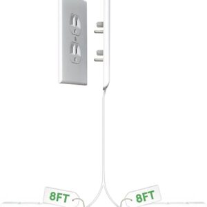 Sleek Socket outlet concealer mounted flat on a wall behind a bed with the cord clipped along the skirting