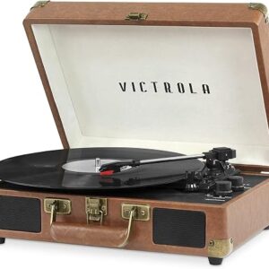 Victrola Journey brown suitcase record player open with a vinyl record on the platter