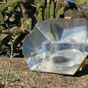 SolCook solar cooker All Season panel unfolded outdoors with its reflective film facing the sun