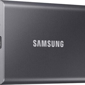 Samsung T7 SSD 1TB portable drive in titan gray next to a laptop